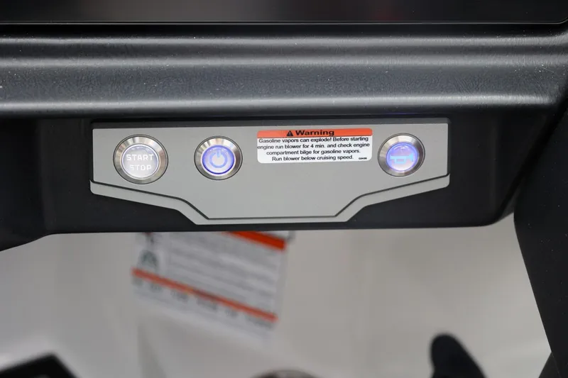 Slide: The Image of Control panel of 2026 Tigé 22RZX boat with start/stop button and warning label. - 41