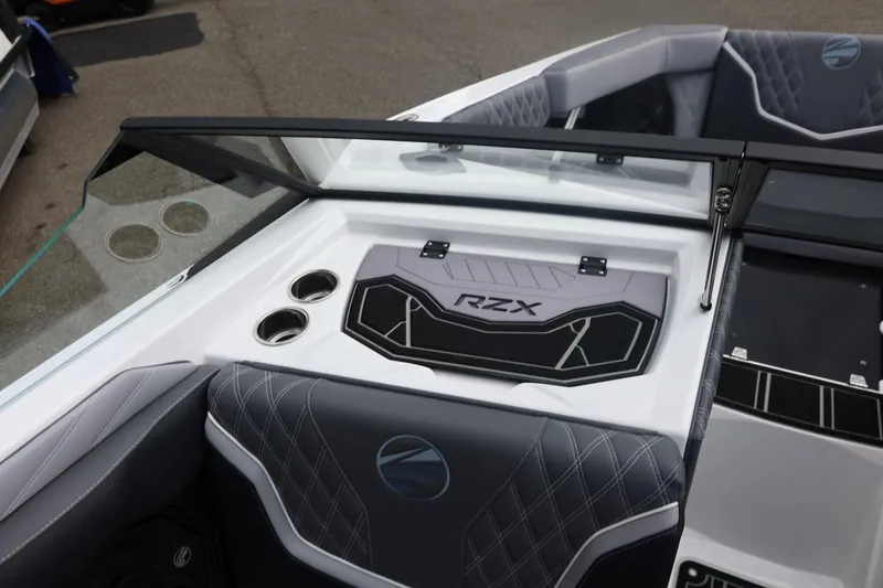 Slide: The Image of 2026 Tigé 22RZX boat interior with sleek design and cup holders. - 42