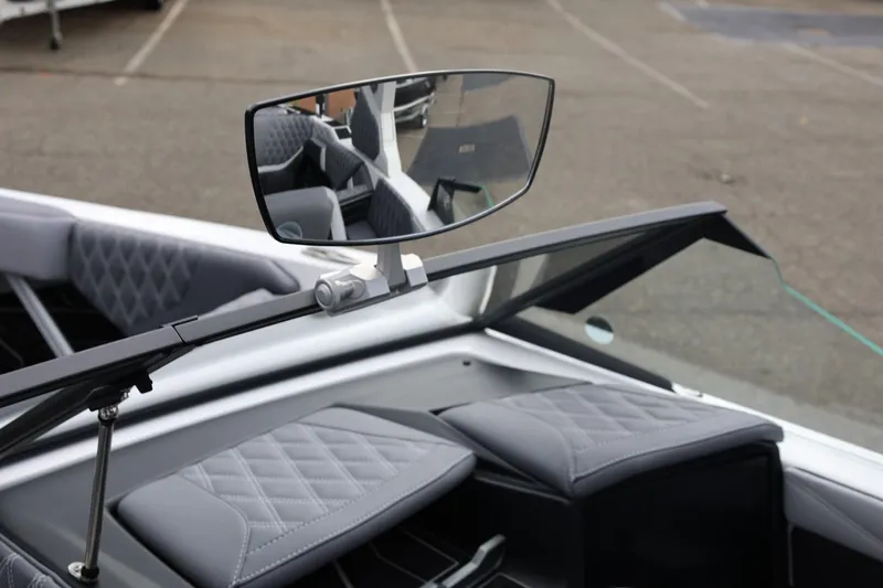 Slide: The Image of 2026 Tigé 22RZX boat interior with rearview mirror and quilted seating. - 43