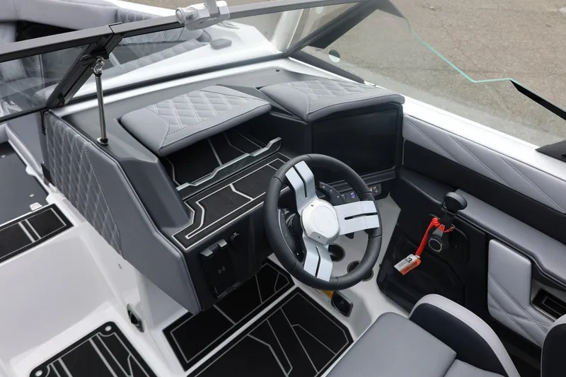 Slide: The Image of 2026 Tigé 22RZX boat interior with modern dashboard and steering wheel design. - 44