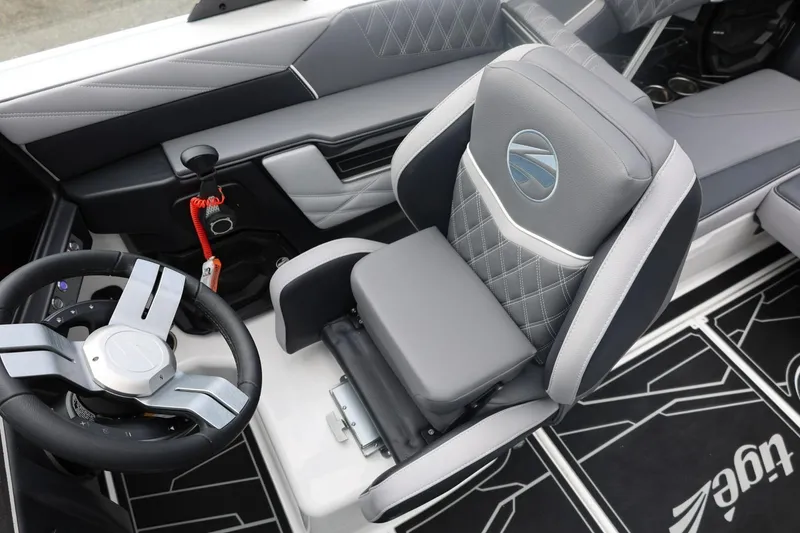 Slide: The Image of 2026 Tigé 22RZX boat interior with modern steering wheel and luxurious seating. - 45