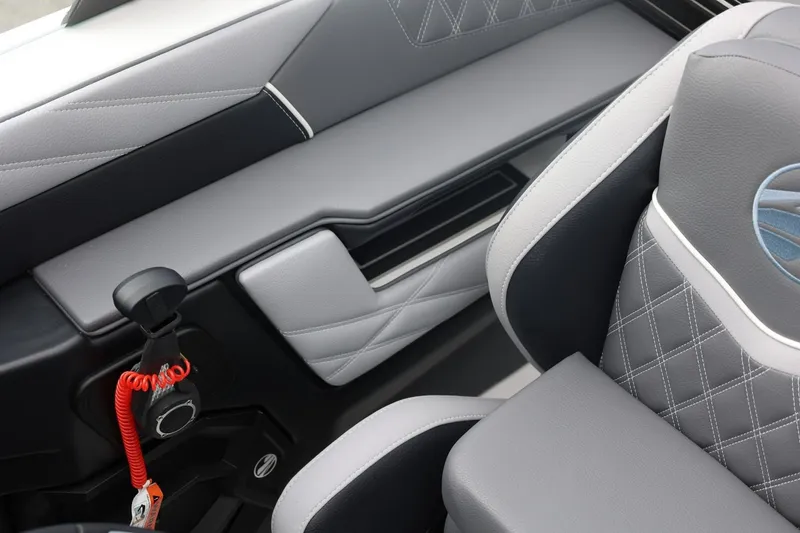 Slide: The Image of Interior of 2026 Tigé 22RZX boat featuring sleek, modern seating and control panel. - 46