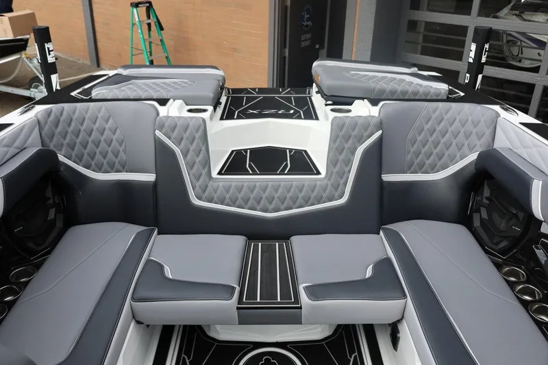 Slide: The Image of Luxurious interior of 2026 Tigé 22RZX boat with gray quilted seating and modern design. - 47