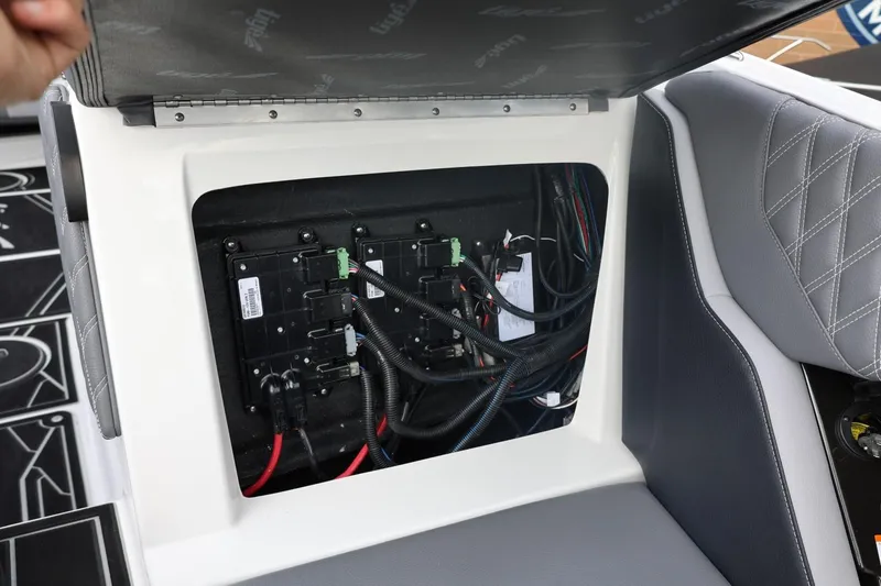 Slide: The Image of Electrical panel inside 2026 Tigé 22RZX boat, showcasing wiring and components. - 52