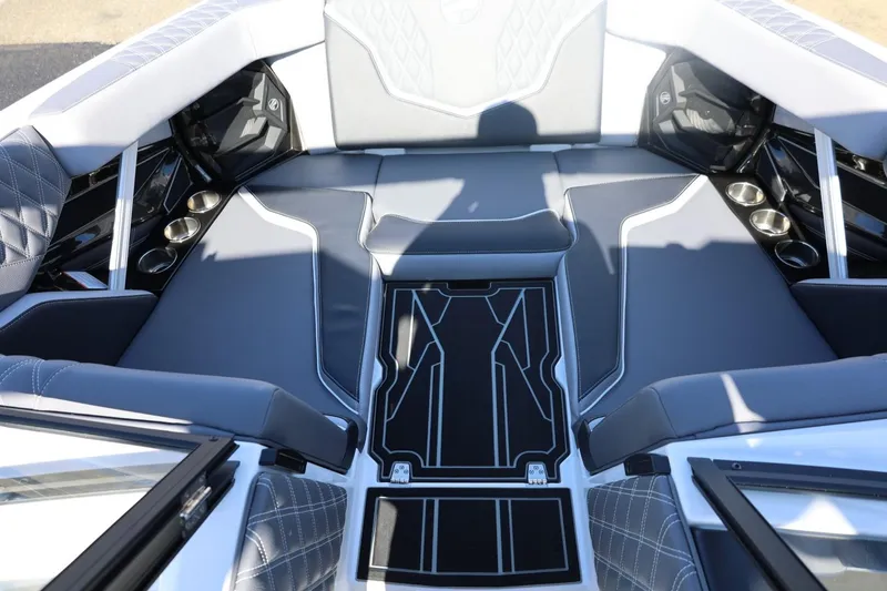 Slide: The Image of 2026 Tigé 22RZX boat interior with luxurious gray seating and cup holders. - 59