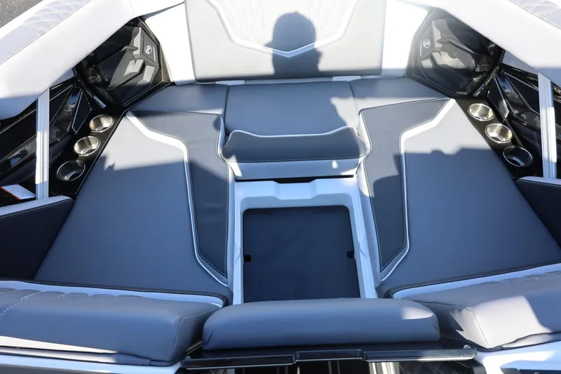 Slide: The Image of 2026 Tigé 22RZX boat interior with gray seating and cup holders. - 60