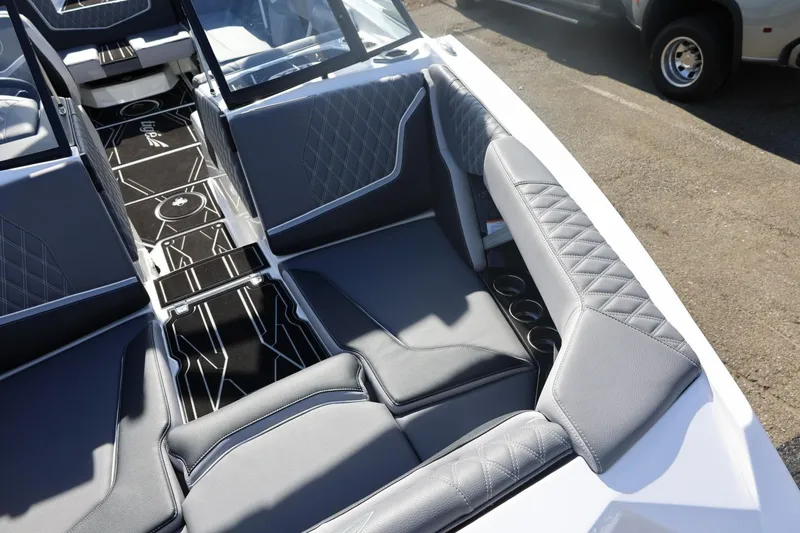 Slide: The Image of 2026 Tigé 22RZX boat interior with sleek gray seating and modern design. - 62