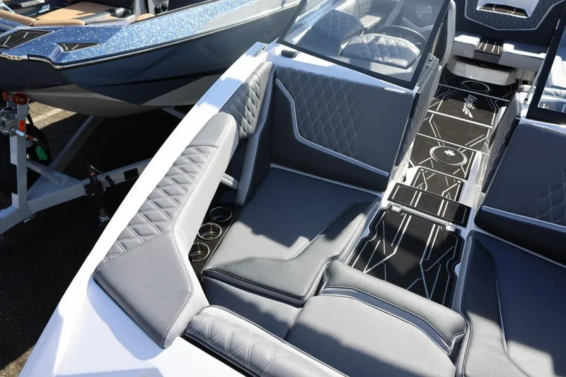 Slide: The Image of 2026 Tigé 22RZX boat interior with luxurious gray seating and stylish flooring design. - 63