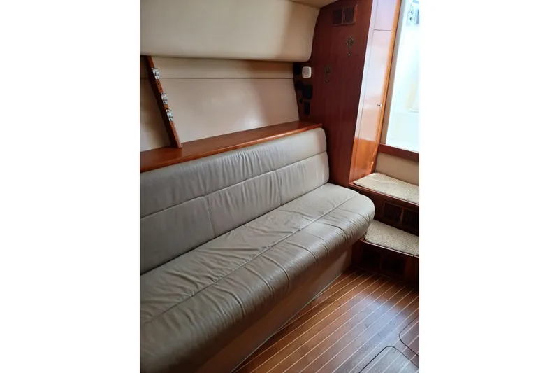 Slide: The Image of 2006 Rampage 33 Express interior with beige leather seating and wooden accents. - 14
