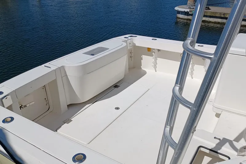 Slide: The Image of 2006 Rampage 33 Express boat deck with ladder, docked by the water. - 5