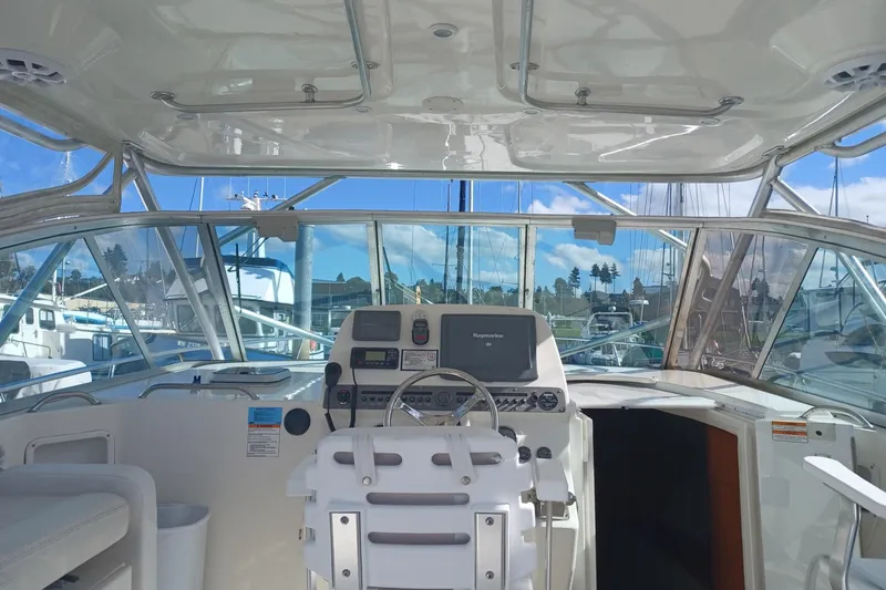 Slide: The Image of 2006 Rampage 33 Express boat cockpit with steering wheel and navigation equipment. - 9