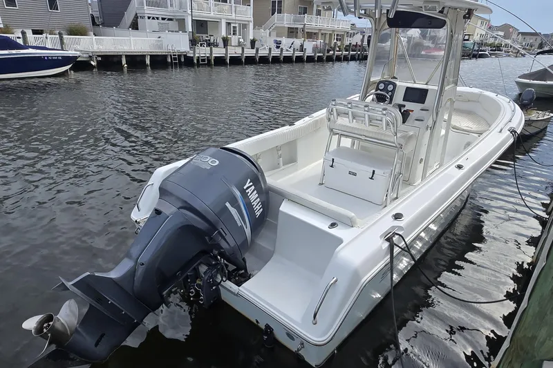 The Image of 2008 Sea Hunt Ultra 232 boat with Yamaha engine docked in a canal. - 0