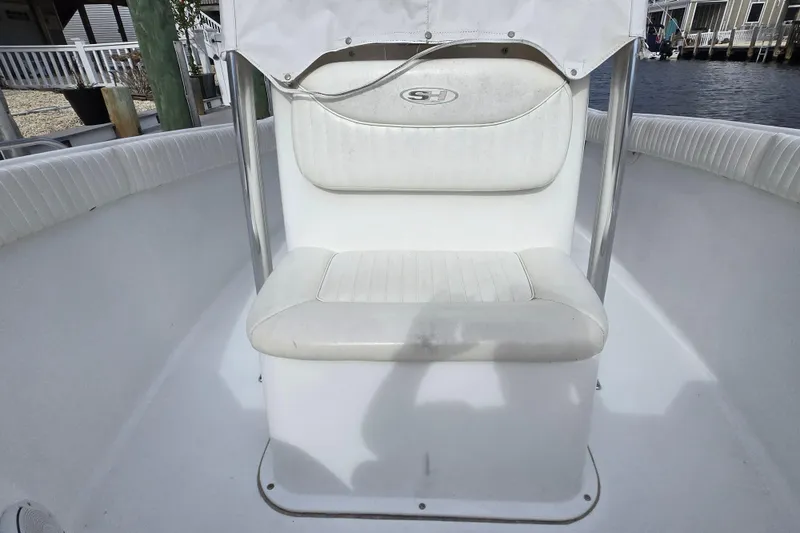 Slide: The Image of Console of 2008 Sea Hunt Ultra 232 boat with steering wheel and gauges. - 11