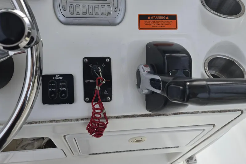 Slide: The Image of Dashboard of a 2008 Sea Hunt Ultra 232 boat with gauges and controls. - 17