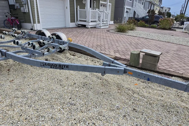 Slide: The Image of Boat trailer on gravel driveway, Sea Hunt Ultra 232, 2008 model. - 19