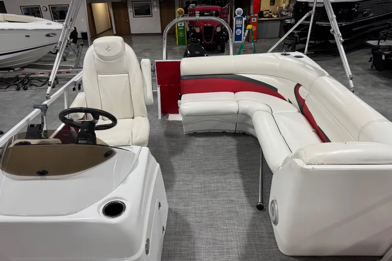 Slide: The Image of Interior of 2015 JC 241 Spirit TT Sport boat with white and red seating. - 9