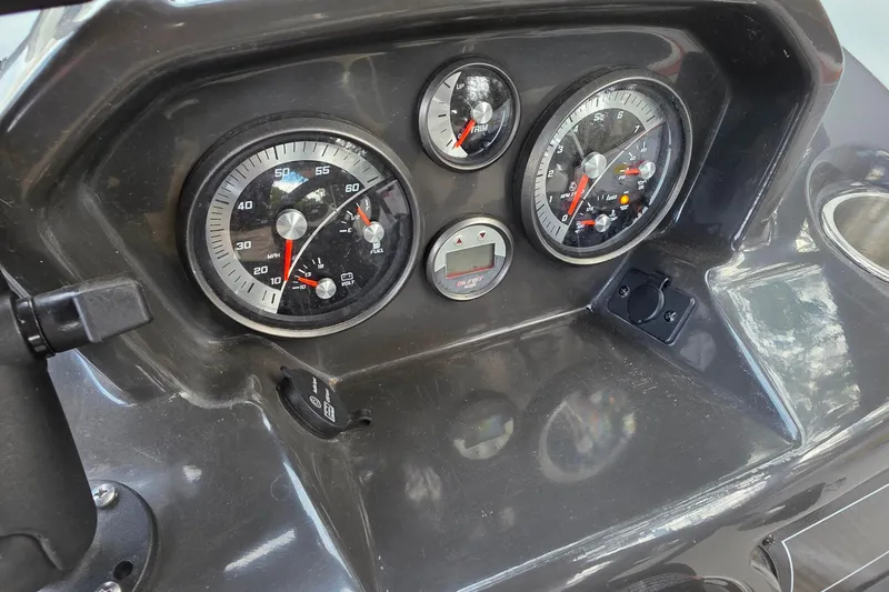 Slide: The Image of Dashboard of 2019 Bayliner VR4 Bowrider I/O with speedometer and gauges. - 10