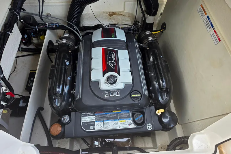 Slide: The Image of 2019 Bayliner VR4 Bowrider I/O engine compartment with Mercury 4.5L 200 HP motor. - 18