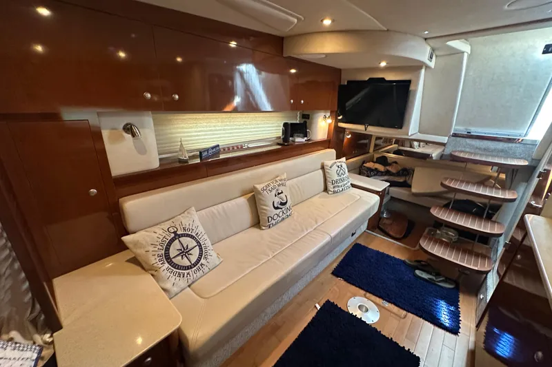 Slide: The Image of Luxurious interior of 2009 Sea Ray 350 Sundancer yacht with plush seating and modern amenities. - 5