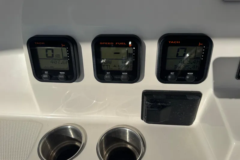 Slide: The Image of Dashboard of 2015 Wellcraft 290 Coastal boat with tachometer and fuel gauges. - 14