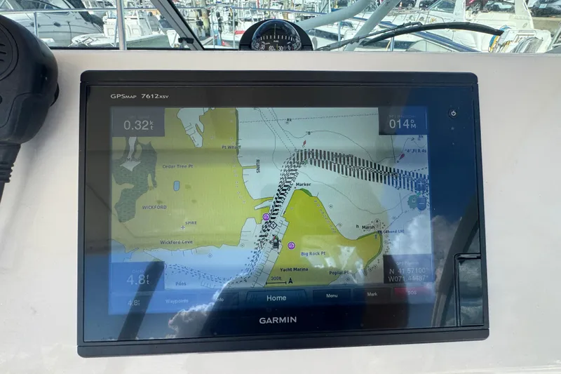 Slide: The Image of Garmin GPS display on 2015 Wellcraft 290 Coastal boat, showing navigational map. - 15