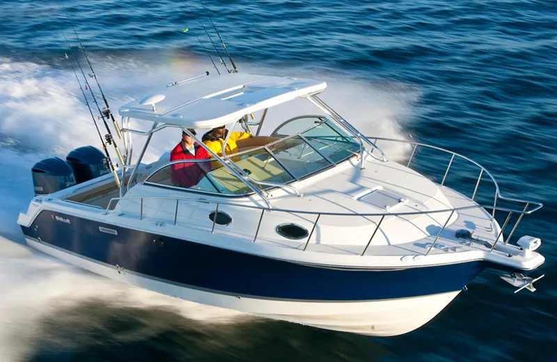 Slide: The Image of Manufacturer Provided Image: 2015 Wellcraft 290 Coastal boat cruising on open water. - 5