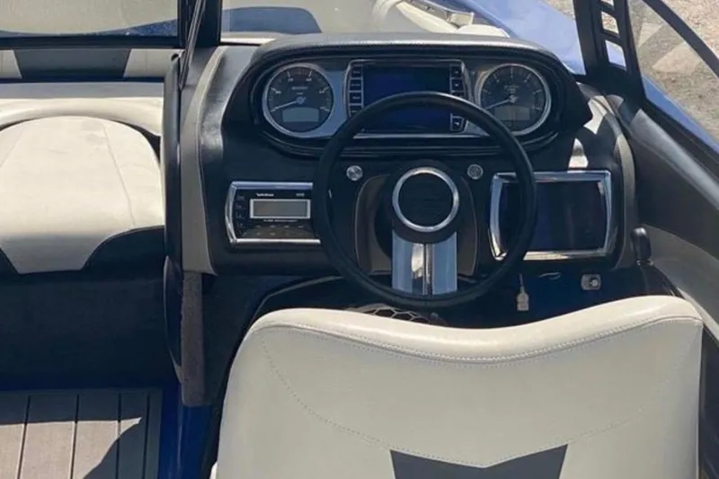 Slide: The Image of Interior view of 2012 Malibu Wakesetter 22 MXZ boat dashboard and steering wheel. - 13