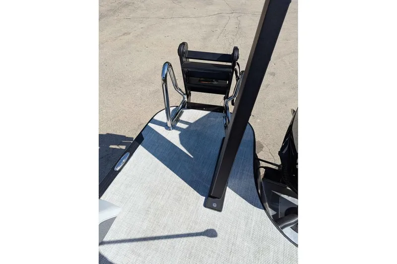 Slide: The Image of Rear view of 2026 Alera M23Q boat with ladder and deck details. - 16