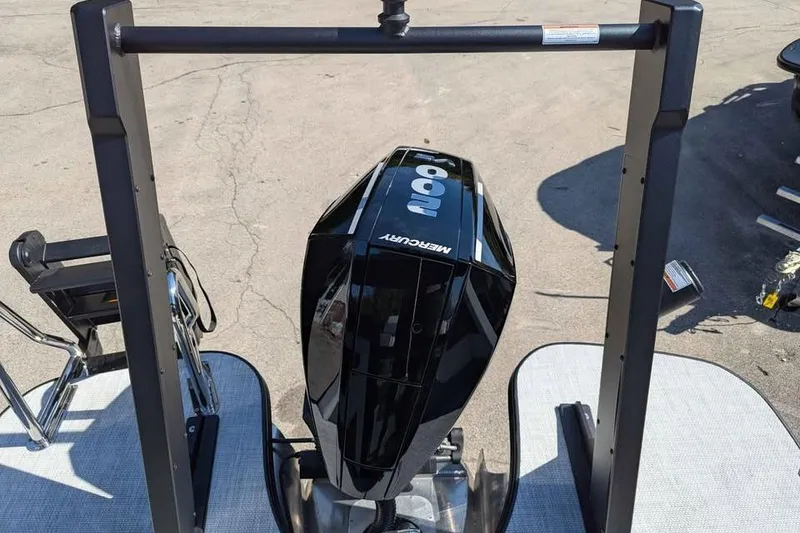 Slide: The Image of 2026 Alera M23Q boat with Mercury outboard motor on display stand. - 17