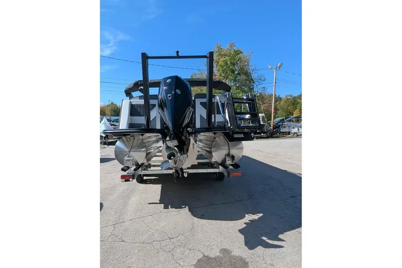 Slide: The Image of 2026 Alera M23Q boat rear view with outboard motor and pontoons. - 3