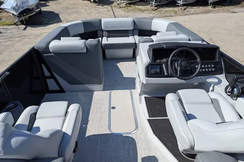Slide: The Image of Interior of 2026 Alera M23Q boat with modern seating and steering console. - 8