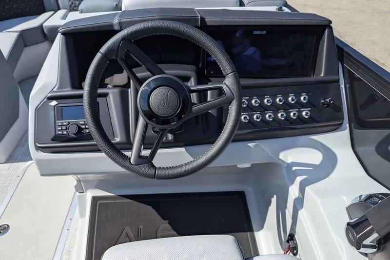 Slide: The Image of Steering console of 2026 Alera M23Q boat with modern controls and dashboard. - 9