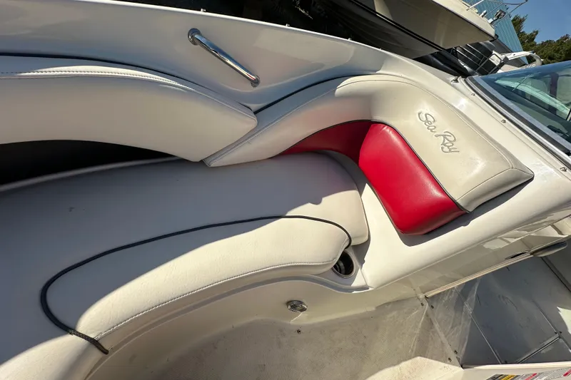 Slide: The Image of 2005 Sea Ray 220 Select boat interior with white and red seating. - 10