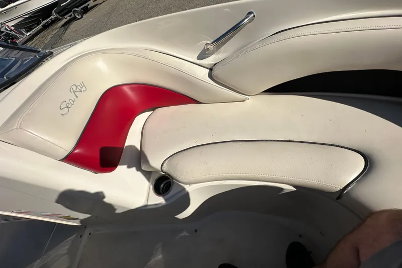Slide: The Image of 2005 Sea Ray 220 Select boat interior with white and red seating. - 11