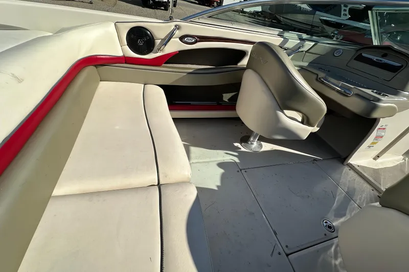 Slide: The Image of 2005 Sea Ray 220 Select boat interior with beige seating and red accents. - 14