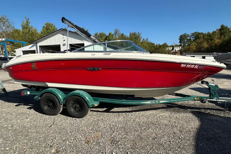 Slide: The Image of Red 2005 Sea Ray 220 Select boat on trailer, parked outdoors. - 3