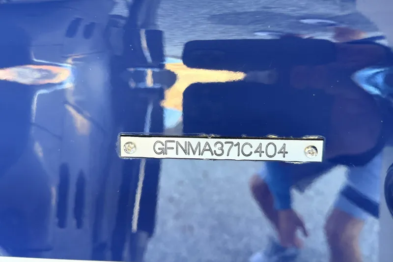 Slide: The Image of 2004 Four Winns 210 Horizon boat hull identification number plate. - 15