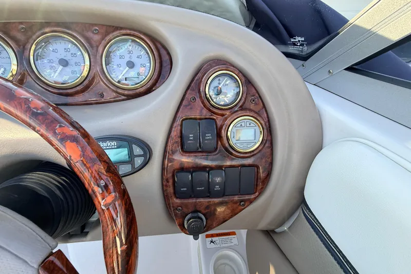 Slide: The Image of Dashboard of 2004 Four Winns 210 Horizon boat with gauges and controls. - 17