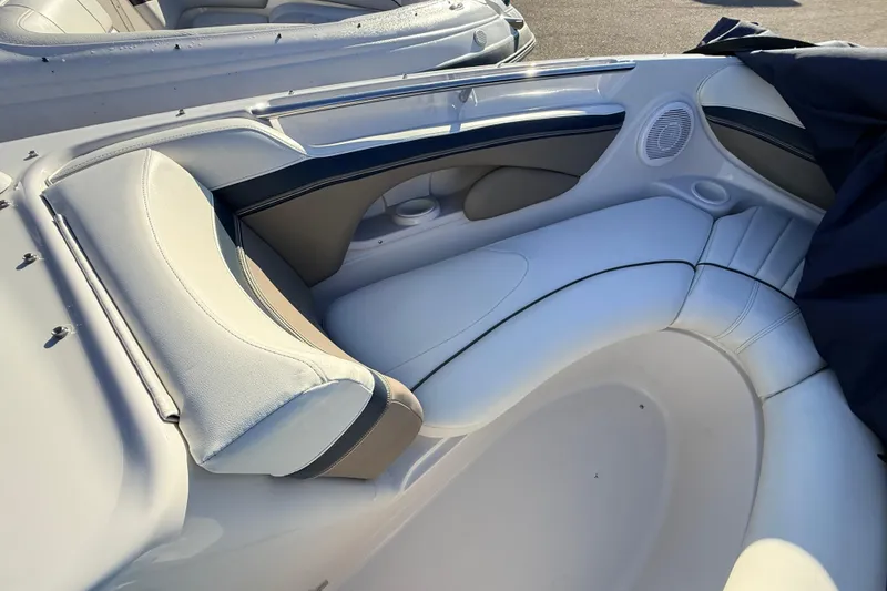 Slide: The Image of 2004 Four Winns 210 Horizon boat interior with white cushioned seating. - 20
