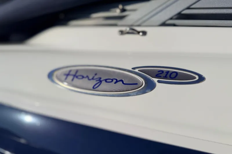Slide: The Image of Close-up of 2004 Four Winns 210 Horizon boat emblem. - 25