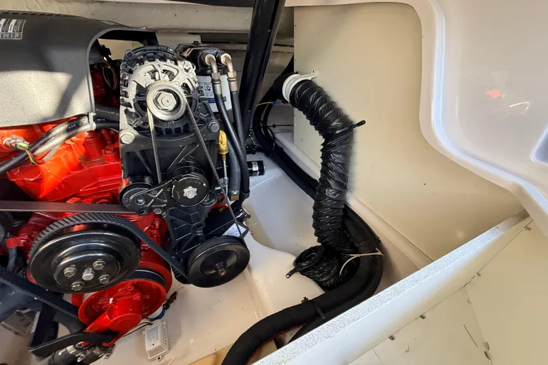 Slide: The Image of Engine compartment of 2004 Four Winns 210 Horizon boat, showcasing mechanical components. - 29