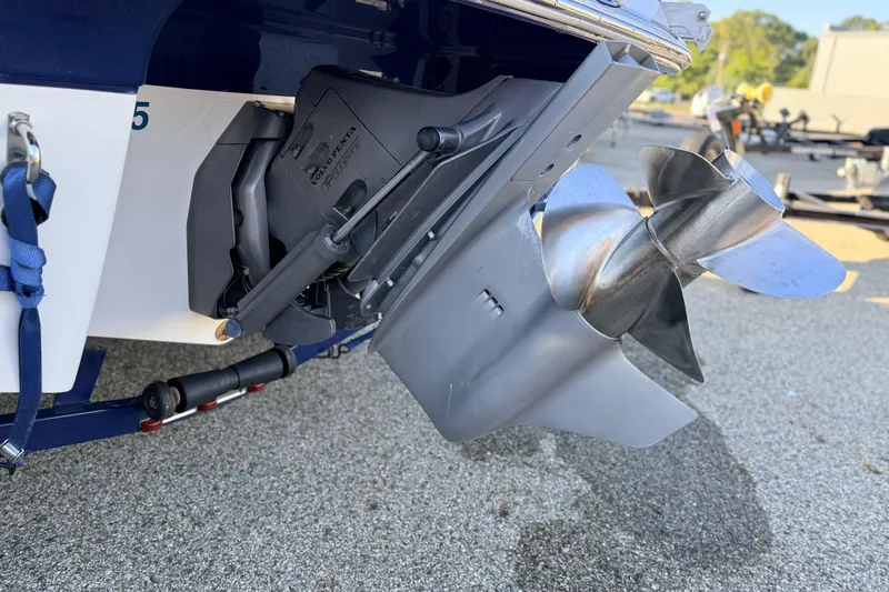 Slide: The Image of 2004 Four Winns 210 Horizon boat propeller and outdrive on a trailer. - 32