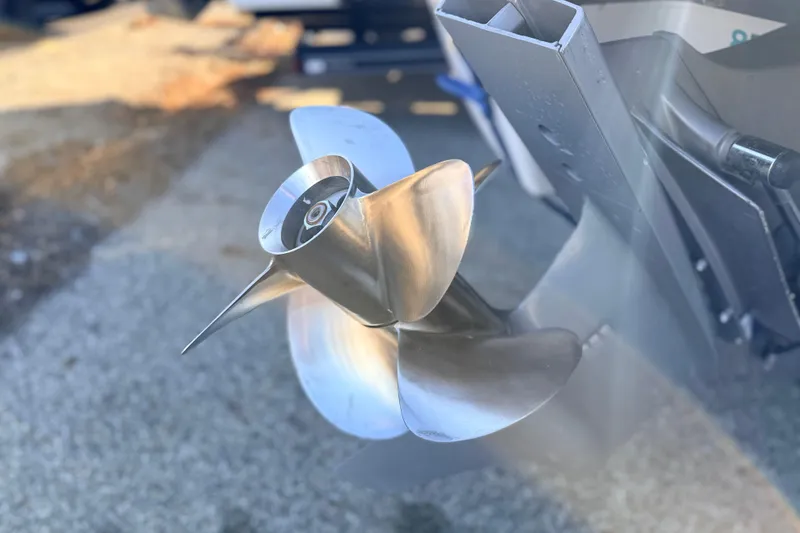 Slide: The Image of Close-up of a 2004 Four Winns 210 Horizon boat propeller, shining in sunlight. - 34