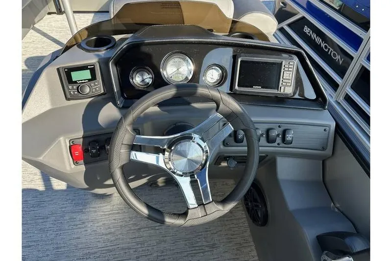 Slide: The Image of Steering console of 2026 Bennington 23 SSR Quad Bench with gauges and controls. - 12
