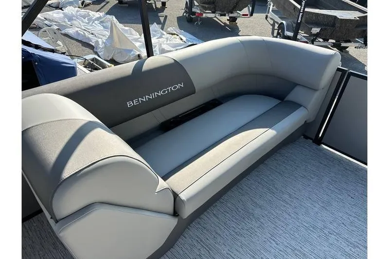 Slide: The Image of 2026 Bennington 23 SSR Quad Bench with gray seating on a boat deck. - 18