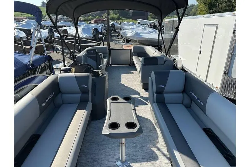 Slide: The Image of 2026 Bennington 23 SSR Quad Bench pontoon boat with spacious seating and canopy. - 19
