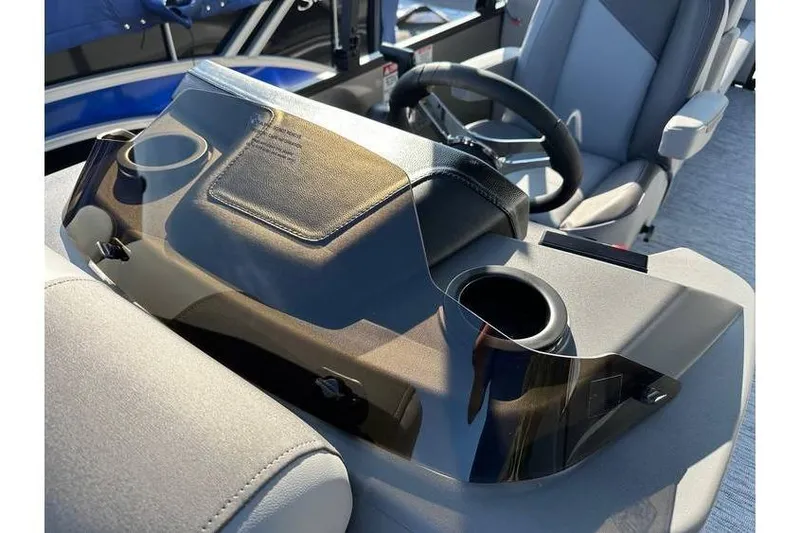 Slide: The Image of 2026 Bennington 23 SSR Quad Bench dashboard with steering wheel and cup holders. - 20