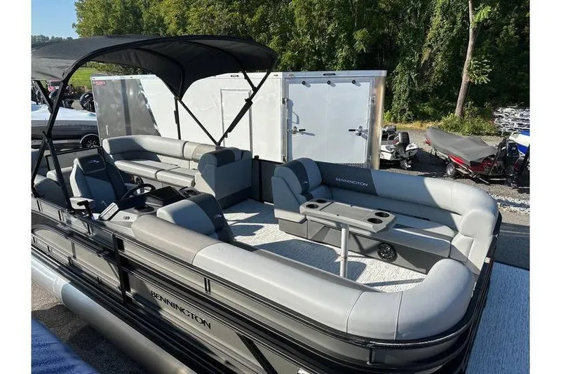 Slide: The Image of 2026 Bennington 23 SSR Quad Bench pontoon boat with spacious seating and canopy. - 7
