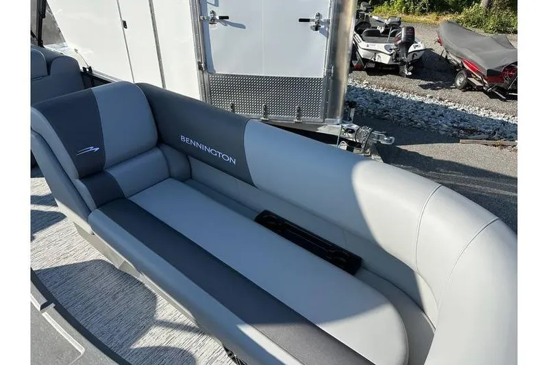 Slide: The Image of 2026 Bennington 23 SSR Quad Bench with sleek gray upholstery. - 9