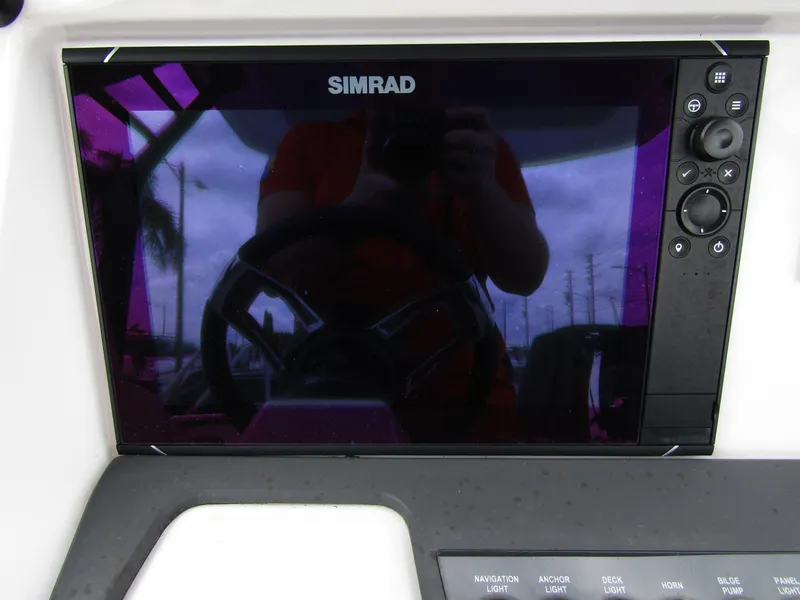 Slide: The Image of Simrad display on 2022 Axopar 22 T-Top boat dashboard. - 13